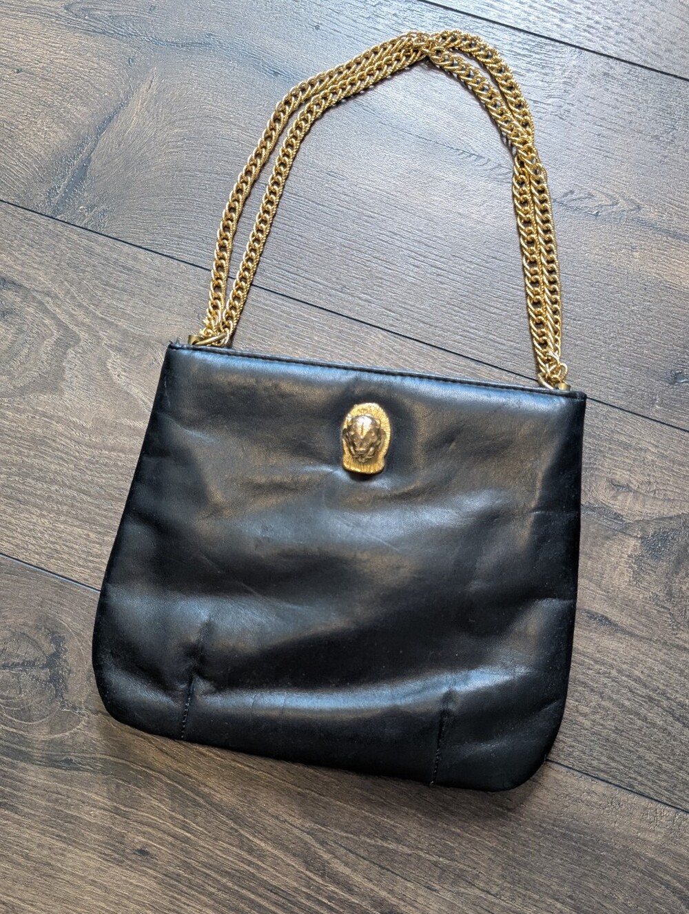 Ruth Saltz Black Leather Shoulder Bag with Gold Chain and Medallion Accent